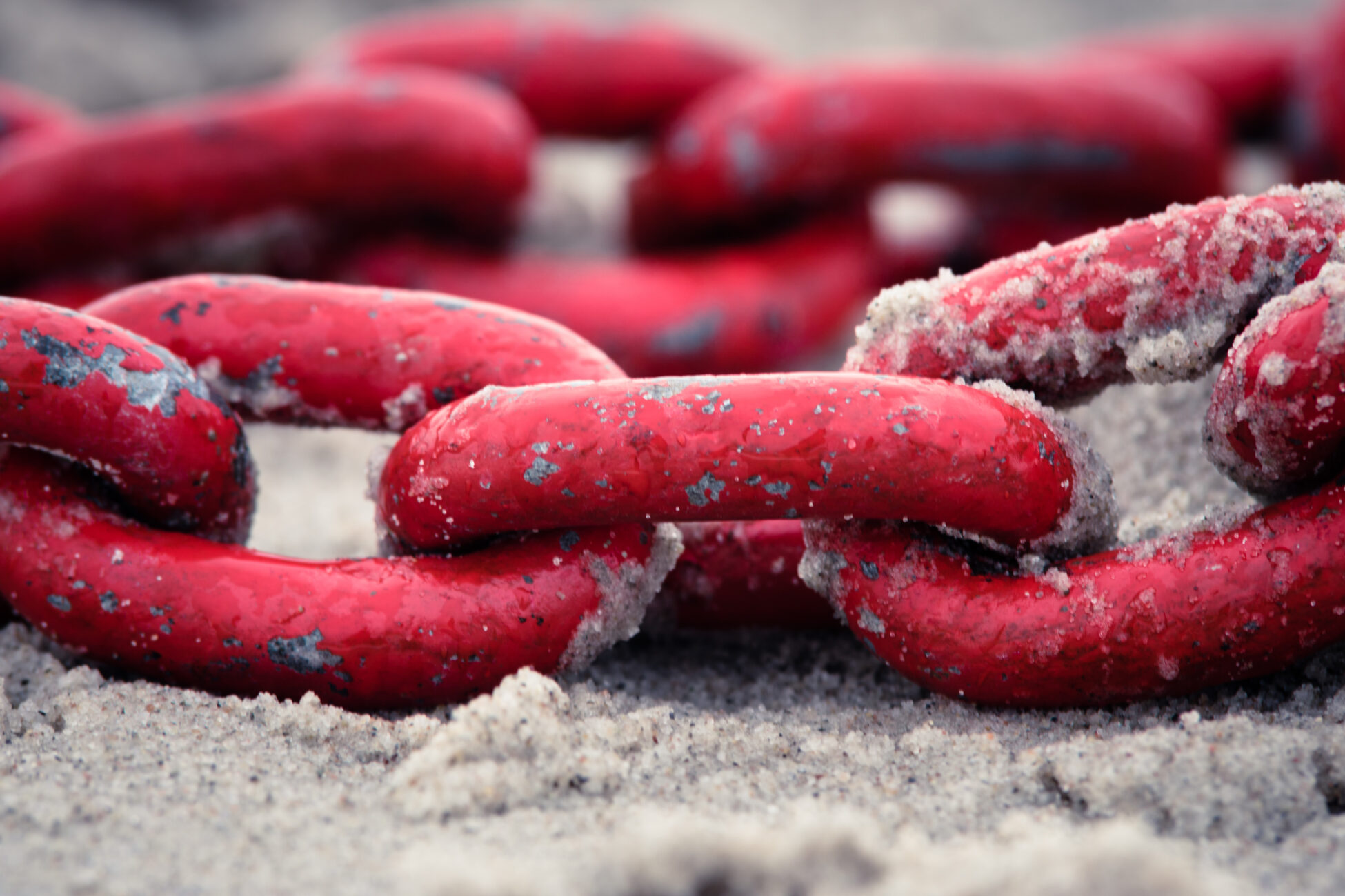 Red chain on beach